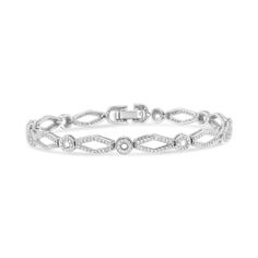 Dress her wrist in luxury with this enticing vintage-inspired diamond bracelet. Crafted in cool weaves of .925 sterling silver, this shimmering design features alternating circle and kite-shaped links that sparkle with diamonds and are lined with intricate milgrain detail. Captivating with 1-1/2 cts. t.w. of diamonds and a brilliant buffed luster, this 7.0-inch bracelet secures with a tongue and groove clasp. Elegant Diamond White Chain Bracelet With Diamond Accents, Classic Adjustable Bracelet With Intricate Design, Classic Adjustable Sterling Silver Bracelet With Intricate Design, Elegant Sterling Silver Chain Bracelet With Intricate Design, Classic Sterling Silver Bracelet With Intricate Design For Wedding, Elegant Adjustable Diamond Bracelet With Accents, Formal Silver Chain Bracelet With Diamond Accents, Silver Heirloom Bracelet For Formal Occasions, Formal Silver Heirloom Bracelet