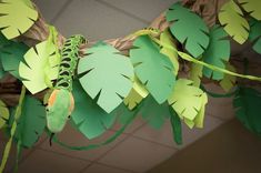 some paper leaves are hanging from a branch