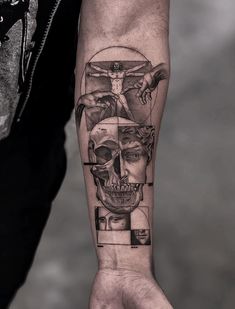 a man's arm with a tattoo on it and a skull in the middle