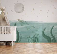 a baby's room with an ocean mural and crib in the foreground