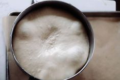 a pan filled with liquid sitting on top of a counter