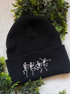 "Say hello to your new favorite hat! This spooky design pairs perfectly with just about anything! It is a great gift for those you love but also, you deserve to treat yourself!! This is not a patch! The stitches are embroidered directly onto the beanie. One size fits most. - Form fitting shape - 100% acrylic knit - 12\" knit - Adjustable cuff, shown as 3\" Please chose your color: Yellow, White, Navy Blue, Forrest Green, Light Gray, Gray or Black. Want another color? Send me a message! Colors ma Beanie With Embroidery, Embroidered Beanie Ideas, Winter Cotton Hat For Gifts, Winter Cotton Hat As Gift, Casual Winter Hats With Custom Embroidery, Cotton Winter Hat As A Gift, Cotton Winter Hat As Gift, Cotton Winter Hat For Gift, Winter Embroidered Cotton Hat