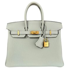 Absolutely Stunning and One The Most Coveted and Difficult to get Hermes Combos! New 2023 Hermes Birkin 25 Gris Neve Togo Leather complimented by Gold Hardware. B Stamp 2023. Includes all accessories and Box. Shop with Confidence from Lux Addicts. Authenticity Guaranteed! Evening Bags With Lock In Epsom Leather, Luxury Calf Leather Bag With Lock, Timeless Calf Leather Bag With Hasp Closure, Evening Epsom Leather Bag With Lock, Business Bags With Lock In Calf Leather, Chic Epsom Leather Bag With Lock, Formal Calf Leather Bag With Lock, Luxury Shopping Bag With Turn-lock Closure, Calf Leather Bag With Hasp Closure For Everyday Use