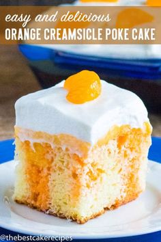 a piece of cake with white frosting and oranges on top sitting on a plate