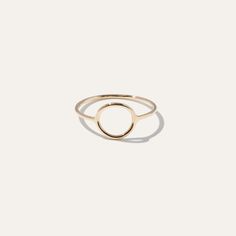 This sleek gold circle ring brings an artful accent to everyday style. Bold enough to wear by itself and minimal enough to compliment a handful of stacked rings. Made in 14k solid gold to stand the test of time. | Women's 14k Circle Ring in Yellow Gold Size 4 | 14k Gold | Quince | Quince | Women's 14k Circle Ring in Yellow Gold, Size 4, 14k Gold Modern Everyday Stackable Rings With Round Band, Modern 14k Gold Stackable Rings, Modern 14k Gold Stackable Round Band Rings, Modern 14k Gold Stackable Rings With Round Band, Timeless Everyday Initial Ring, Yellow Gold Initial Ring For Everyday, Modern Yellow Gold Rings For Everyday, Simple Yellow Gold Initial Ring For Everyday, Everyday Stackable Rings In Recycled Gold