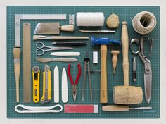 various tools are laid out on a cutting board