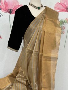 This party wear tissue saree is ideal for occasions when you want to look your best. It is made from high-quality materials and designed with precision to ensure a gorgeous look. The tissue saree is perfect for adding a hint of style and sophistication to any outfit. Black velvet blouse size 34-38 fall & pico done Velvet Saree Blouse, Black Velvet Blouse Design, Velvet Blouse Design, Black Velvet Blouse, Velvet Saree, Saree Party Wear, Velvet Blouse, Tissue Saree, Party Wear Saree