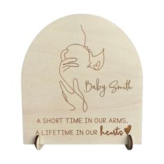 a wooden plaque with the words, baby smith