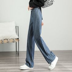 Unleash Your Style with Every Step Discover the perfect blend of retro charm and modern fashion with our High-Waist Striped Wide-Leg Jeans. Designed for women who appreciate both style and comfort, these jeans feature a striking striped pattern that sets you apart from the crowd. Whether you're stepping out for a casual coffee date or gearing up for a day in the city, these pants promise versatility and a trendy look for every season. Product Features Our wide-leg jeans are crafted from a high-quality mix of cotton and viscose, ensuring breathability and comfort. The slight stretch in the fabric accommodates your every move, making them ideal for all-day wear. With a loose fit and a high-rise design, they accentuate your waist and elongate your legs, providing a flattering silhouette for a Wide Leg Denim Bottoms With Vertical Stripes, Denim Wide Leg Bottoms With Vertical Stripes, Striped Wide Leg Denim Jeans, Trendy Striped Wide-leg Pants, Striped Wide-leg Denim Pants, Street Style Aesthetic, Cardigan Sweater Vest, Jean Large, Crop Top Shirts