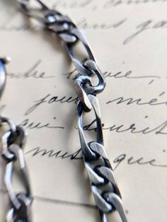 Nice silver watch chain with a c clasp and a dog clasp, with patina. The watch chain is in good antique condition, but has traces of wear due to its age. Length: about 29 cm. Metal Figaro Chain Link Bracelet, Silver Figaro Chain Link Bracelet, Antique Engraved Chain Link Necklace, Sterling Silver Oxidized Link Chain Bracelet, Handmade Sterling Silver Link Bracelet For Formal Occasions, Oxidized Metal Chain Bracelet With Oval Links, Engraved Silver Chain Bracelet With Rectangular Links, Silver Link Chain Bracelet With Lobster Clasp, Silver Engraved Chain Bracelet With Rectangular Links