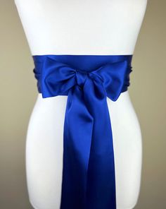 "Cobalt Satin Sash Cobalt Blue Sash, Bridal Sash  Blue Wedding Dress Sash  Dark Royal Blue Dress Sash  Cobalt Wedding Gown Sash  Satin Swank  Make this Satin Swank® reversible waist sash the perfect finishing touch for your wedding, bridesmaid, or special occasion dress, or just the right piece to add instant polish to your dress or top.  This extra long version is 3.5 inches wide, 120 inches long, and will wrap around most waist sizes two times with a generous length remaining to tie in a bow o Fitted Satin Bow Sash For Bridesmaids, Blue Party Dress With Sashes, Blue Wedding Dress With Satin Bow, Fitted Bow Sash For Bridesmaid, Fitted Bridesmaid Sash With Bow, Elegant Blue Party Sashes, Formal Bridal Belt With Satin Bow, Formal Fitted Sash With Tie Back, Elegant Blue Sashes For Wedding