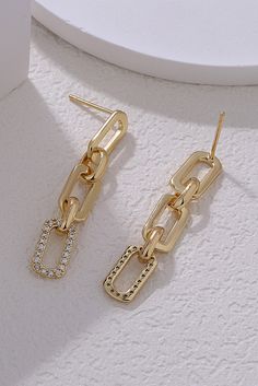 These elegant gold chain link earrings are the perfect addition to any outfit. Made with high-quality materials, they are both stylish and durable. Elevate your look with these stunning earrings that make a statement without being overpowering. The perfect gift for yourself or a loved one! Material: Copper Chain Link Earrings, Unique Plates, Stud Design, Link Design, Elegant Color, Link Earrings, Rhinestone Decor, Bow Earrings, Rhinestone Designs