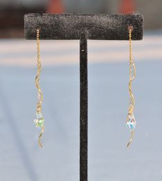 "Stunning new earrings made using unique, 14K gold vermeil threaders and Swarovski crystal. Earrings are threader style, with a twisted gold wire. From them, hangs a cut crystal drop from Swarovski. They are crystal clear with an AB coating on one side. These are amazingly cut and faceted, and sparkle beautifully. Crystals measure roughly 1/2\" (12mm) long. I offer two lengths. Large - total length 6\" long , roughly 3\" when worn doubled Short - total length 3.5\", roughly 2\" when worn doubled Gold Briolette Crystal Earrings With Ear Wire, Gold Wire Wrapped Sterling Silver Crystal Earrings, Gold Crystal Earrings With Ear Wire, Gold Briolette Crystal Earrings For Pierced Ears, Gold Hypoallergenic Drop Crystal Earrings, Hypoallergenic Gold Drop Crystal Earrings, Gold Long Drop Crystal Earrings For Jewelry Making, Gold Long Drop Pierced Crystal Earrings, Threader Earrings Gold