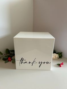 a white box with the words thank you written on it