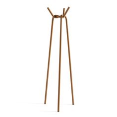 two wooden sticks are standing upright on the white floor, with one stick sticking out of it's side