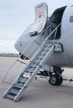 the stairs are attached to the side of an airplane