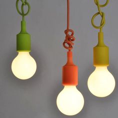 three light bulbs hanging from the ceiling with one bulb turned on and two being turned off