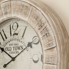 an old town clock is displayed on the wall