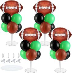 four footballs and balloons are on top of each other