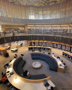 an overhead view of a library with many bookshelves and people sitting at tables