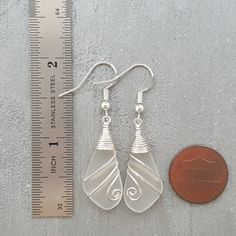 "Aloha! These design shows my love for this beautiful island of Hawaii. This item will be made to order and shipped directly from Hawaii. This is sea glass earrings with silver hooks. This handmade in Hawaii jewelry gift is from cultured sea glass that are specially formed into its shape for jewelry making. Each comes with a gift box with \"handmade by yinahawaii\" stamp and a ribbon wrapped as shown in the 2nd photo, ready to give as gift. I also offer Free gift messaging with the order. Please Silver Sea Glass Earrings For Gift, Minimalist Sea Glass Jewelry For Beach, Handmade Dangle Sea Glass Jewelry, Handmade Sea Glass Dangle Jewelry, Minimalist Beach Jewelry With Ear Wire, White Sea Glass Jewelry Gift, Sea Glass Dangle Earrings With Ear Wire, Nickel-free Sea Glass Jewelry For Jewelry Making, Teardrop Sea Glass For Jewelry Making