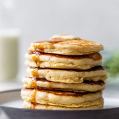 a stack of pancakes with syrup on top