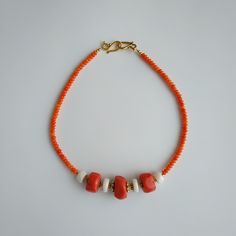 < Orange and white coral beaded necklace > This product made according to the model of authentic traditional Ukrainian jewelry. The coral is modern, the design is vintage. Like 99% of the coral on the market these days, this coral has been dyed. I use bamboo coral which is not endangered or threatened in any way, unlike natural pink or red coral (the production of which is forbidden almost everywhere in the world). Bamboo coral doesn't mean it's not organic. Every bead of it has a distinct Handmade Red Coral Beads For Jewelry Making, Orange Red Coral Beads For Jewelry Making, Traditional Coral Beaded Necklaces, Orange Red Coral Gemstone Beaded Necklaces, Orange Red Coral Gemstone Beaded Necklace, Artisan Coral Beaded Necklace Handmade, Handmade Artisan Coral Beaded Necklaces, Artisan Handmade Coral Beaded Necklace, Polished Coral Beaded Necklaces