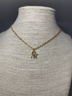 18k gold-filled NY Yankees pendant on 18k gold-filled chain. **CARE INSTRUCTIONS** Keep your necklace dry. Avoid exposure to swimming. Apply makeup, hairspray, or lotions before putting jewelry on. Gently wipe with a polishing cloth to remove any skin oils, makeup, etc Do not use abrasive chemicals or products to clean. Use warm, soapy water. Keep your gold-filled jewelry as dry as possible and away from pesky humidity! Please make sure you store it individually in an air-tight plastic bag, as r Yankees Necklace, Turtle Necklace, Jewelry Accessories Ideas, Dope Jewelry, Ny Yankees, Jewelry Fashion Trends, Charm Necklaces, Jewelry Lookbook, Girly Jewelry