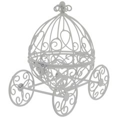 a white metal carriage with wheels and hearts on the front is hanging from a chain