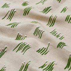 a close up view of a green and white fabric