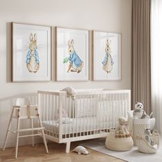 a baby's room with three framed pictures on the wall