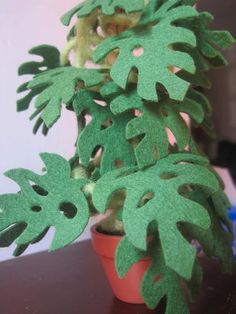 a potted plant that has been cut out to look like it is sitting on a table