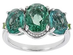 4.85ctw Oval Teal Fluorite With 0.04ctw Round Tsavorite Garnet Rhodium Over Sterling Silver Ring. Measures Approximately 0.80"L x 0.44"W. Not sizeable. Classic Multi-stone Green Gemstones, Classic Green Multi-stone Gemstones, Oval Multi-stone Emerald Gemstones, Classic Green Gemstones With Accents, Formal Oval Emerald Ring With Gemstone Accents, Oval Emerald Gemstones With Accents, Oval Multi-stone Tsavorite Rings, Oval Tsavorite Multi-stone Ring, Oval Emerald Ring With Gemstone Accents