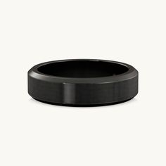 a black wedding ring on a white background