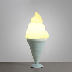 an ice cream cone lamp on a table