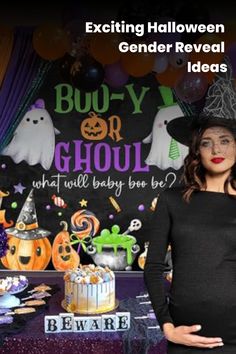 a woman standing in front of a table with halloween decorations