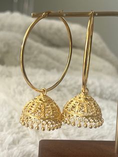 Exotic Bollywood inspired gold plated super light domed jhumkis on jumbo steel hoops.  Antique silver colored dome dangles on 50 mm gold plated hoops Earrings dangles approximately 4 inches long and are super light. Luxury 22k Gold Traditional Chandbalis, Traditional Luxury Gold Chandbalis, Festive Gold Metal Hoop Earrings, Festive Filigree Hoop Earrings, Festive Metal Hoop Earrings With Intricate Design, Temple Jewelry Style Intricate Dangle Hoop Earrings, Festive Metal Hoop Earrings In Temple Jewelry Style, Festive Gold Plated Dangle Hoop Earrings, Temple Jewelry Round Hoop Earrings For Celebration