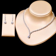 A beautiful three-piece bridal jewelry set that will add elegance and sophistication to any wedding gown or formal ensemble! Adorned with intricately faceted cubic zirconia that capture the light from every angle with a perfectly translucent appeal, the pieces are platinum plated for a flawless finish which enhances the intricate detailing and conveys a modern take on old elegance. Necklace: 17" (approx. 43cm) long with a secure fold-over closure (a 2" extension chain can be added upon request, Formal Diamond White Cubic Zirconia Bridal Sets, Diamond White Cubic Zirconia Bridal Sets For Formal Occasions, Elegant Diamond Jewelry Sets With Rhinestones, Elegant Crystal Bridal Sets For Bride, Dazzling Diamond Accented Jewelry Sets For Wedding, Elegant Cubic Zirconia Bridal Sets For Formal Occasions, Formal Bridal Sets With Elegant Cubic Zirconia Design, Formal Bridal Sets With Sparkling Crystal Stones, Formal Cubic Zirconia Bridal Sets With Elegant Design