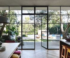 an open kitchen with sliding glass doors leading to the backyard