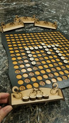 a game board sitting on top of a table with lots of holes in the middle