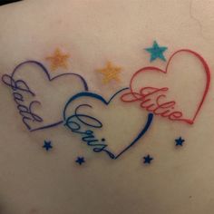 the back of a woman's stomach with two hearts and stars on it, which are written in cursive writing