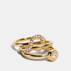 Gold-plated brass Set of three "Available at Coach Outlet" Halo Ring Set, Coach Earrings, Halo Ring Setting, Bow Choker, Coach Fashion, Coach Jewelry, Ring Trends, Coach Outlet, Gold Ring Sets