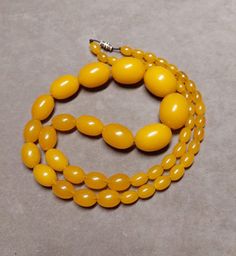 67 Grams Antique Bakelite Necklace Beads. - Etsy Vintage Large Beads For Jewelry Making, Vintage Oval Beaded Necklaces For Jewelry Making, Vintage Necklace With Polished Oval Beads, Vintage Amber Beaded Necklaces With Round Beads, Vintage Amber Polished Beads, Gems, And Cabochons, Vintage Yellow Round Bead Necklaces, Amber Beaded Necklaces With Large Oval Beads, Amber Beaded Necklace With Large Oval Beads, Vintage Amber Oval Beads Jewelry