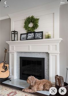 a dog sitting in front of a fire place with a wreath on top of it