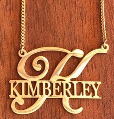 Create personalized gifts for yourself or your loved ones. This gold plated necklace features a large initial overlaid with a full name. (please allow up to 2 weeks for customizations & delivery) Leave name in notes at checkout. *chain length 18" Elegant Monogram Nameplate Necklace, Classic Monogram Name Necklace For Anniversary, Gold Letter Initial Necklace As Personalized Gift, Custom Name Initial Pendant Necklace In Gold, Monogrammed Yellow Gold Name Necklace For Mother's Day, Yellow Gold Monogram Name Necklace For Mother's Day, Gold Initial Pendant Necklace With Custom Name, Gold Initial Necklace With Custom Name, Elegant Gold Initial Necklace With Custom Name