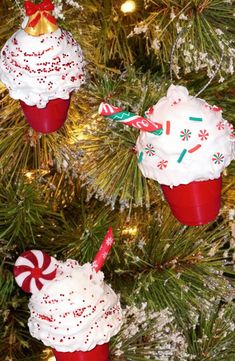 three christmas cupcake ornaments hanging from a tree