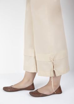 Description : Beige Cambric Culottes with a tie-up detailing for Women. Country of Origin : Pakistan General Care Instruction : Should be washed in gentle cycle and hung to dry. Color may bleed so please be mindful of other items with it. General Disclaimer Size chart provides reference sizes and actual sizes might be slightly different from the size chart. Actual colors of the outfit may vary from the colors being displayed on the screen. Cotton Pants With Tie Waist, Spring Cotton Pants With Tassels, Cotton Pants With Tassels For Spring, Spring Casual Pants With Tassels, Casual Spring Pants With Tassels, Casual Spring Tassel Pants, Be Mindful, Modest Outfits, Mule Shoe