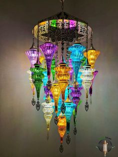 a multi colored chandelier hanging from the ceiling