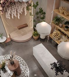 an overhead view of a living room filled with furniture and flowers in vases on tables