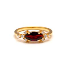 This Natural Garnet Ring is a stunning expression of sophistication, handcrafted from 925 silver and embellished with sparkling moissanite accents. A perfect gift for her, this ring exudes elegance and charm, making it an ideal choice for any occasion, whether it's a declaration of love in an engagement or a stylish addition to everyday wear. The focal point of this ring is the natural garnet gemstone, radiating deep hues of red, symbolizing passion, vitality, and love. Enhanced by the brillianc Elegant Marquise Ruby Ring As Gift, Wedding Rings With Garnet And Rose Cut Diamonds, Elegant Marquise Ruby Ring Gift, Red Cubic Zirconia Cluster Ring As A Gift, Wedding Rings With Rose Cut Diamonds And Garnet, Moissanite Marquise Ring As Gift, Wedding Garnet Cluster Ring In Fine Jewelry Style, Wedding Fine Jewelry Garnet Cluster Ring, Gold Garnet Ring For Wedding